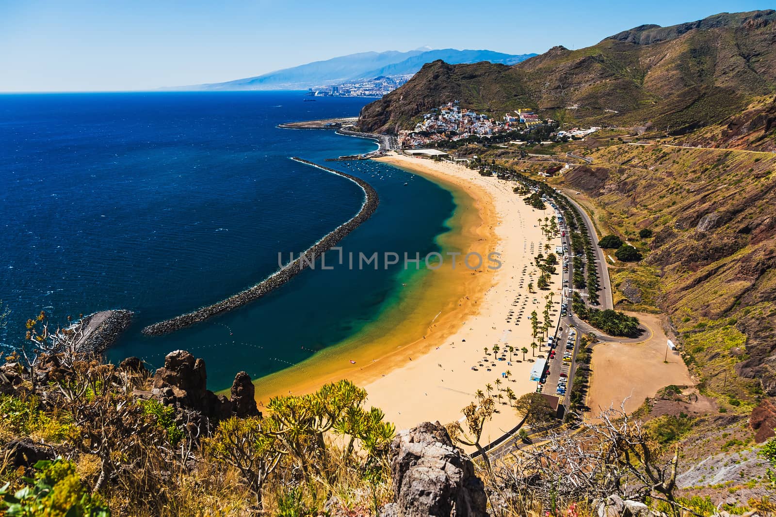 View from mountain to beach or playa Las Teresitas in Santa Cruz on coast of the Atlantic ocean on Tenerife Canary island, Spain at spring or summer