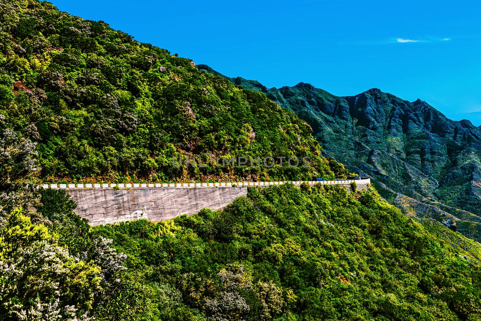 Green mountains or rocks with road and blue sky with cloud landscape in Tenerife Canary island, Spain