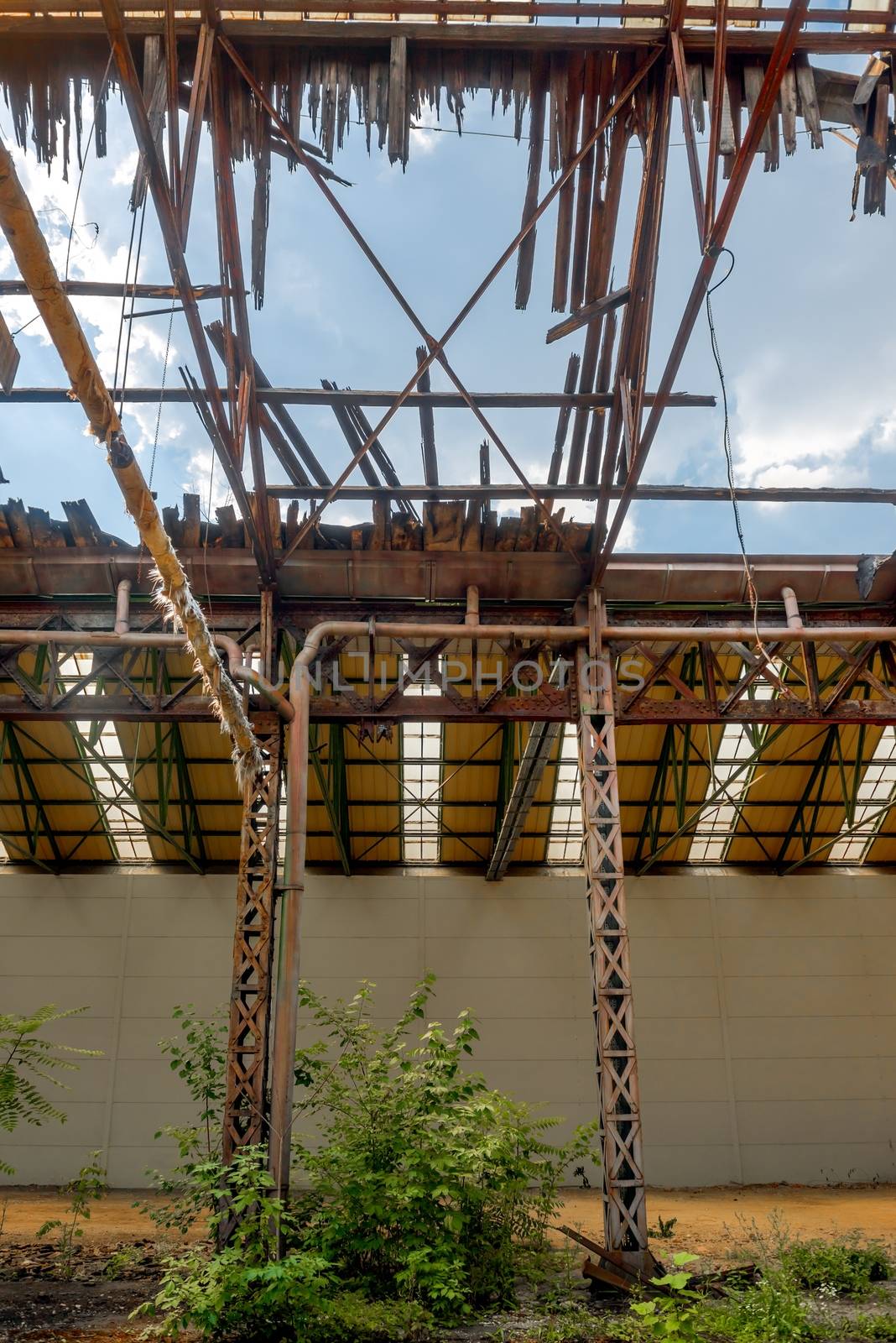 Abandoned industrial interior with bright light rooftop