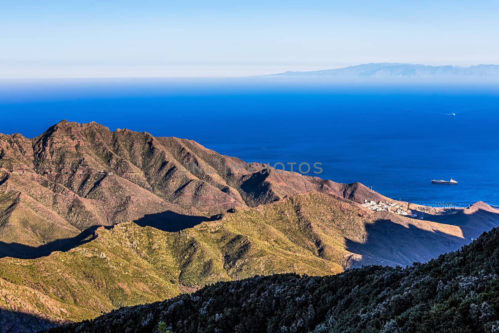 View to ocean or sea with ship from above from rock or mountain with island on background