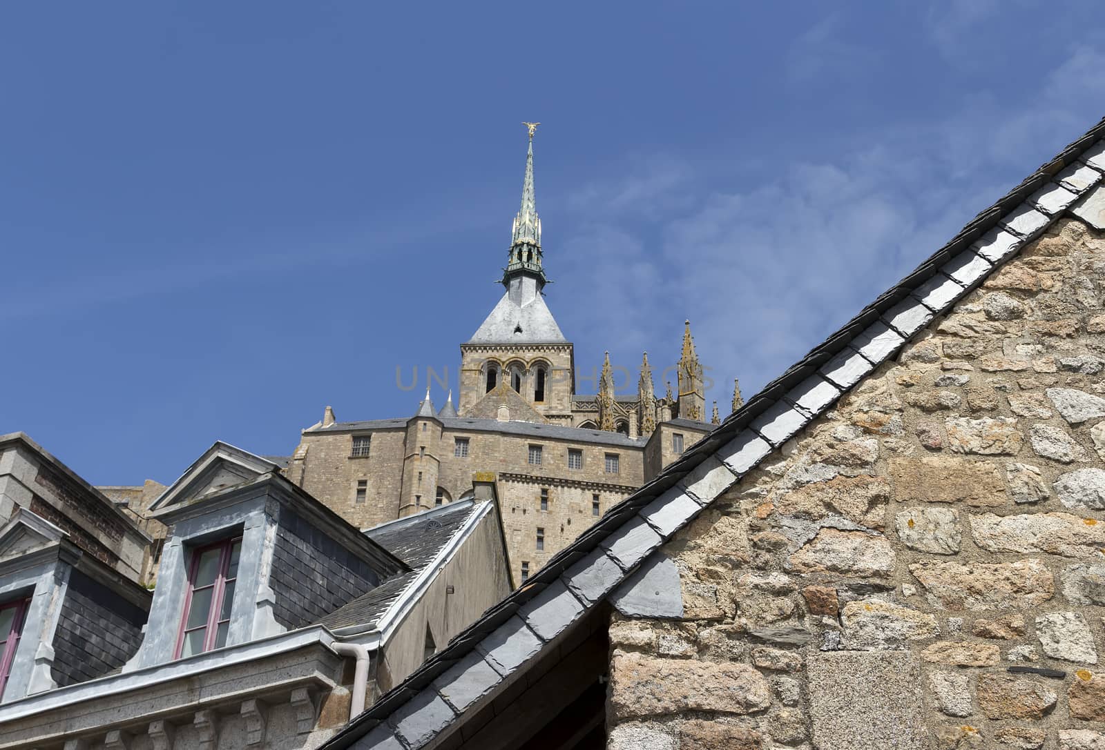 Details from inside Mont St Michel with the top of the abbey