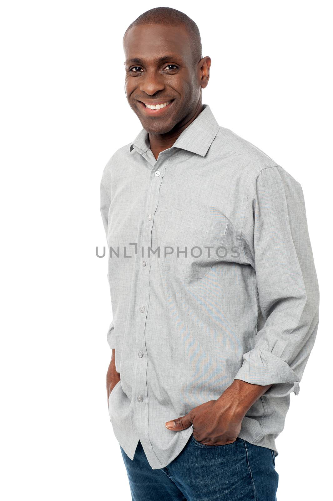 Smiling man posing in casuals by stockyimages