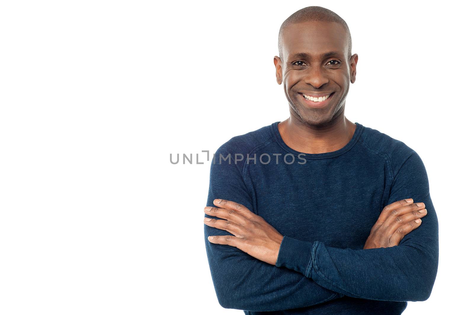 Image of a confident handsome man with arms crossed 