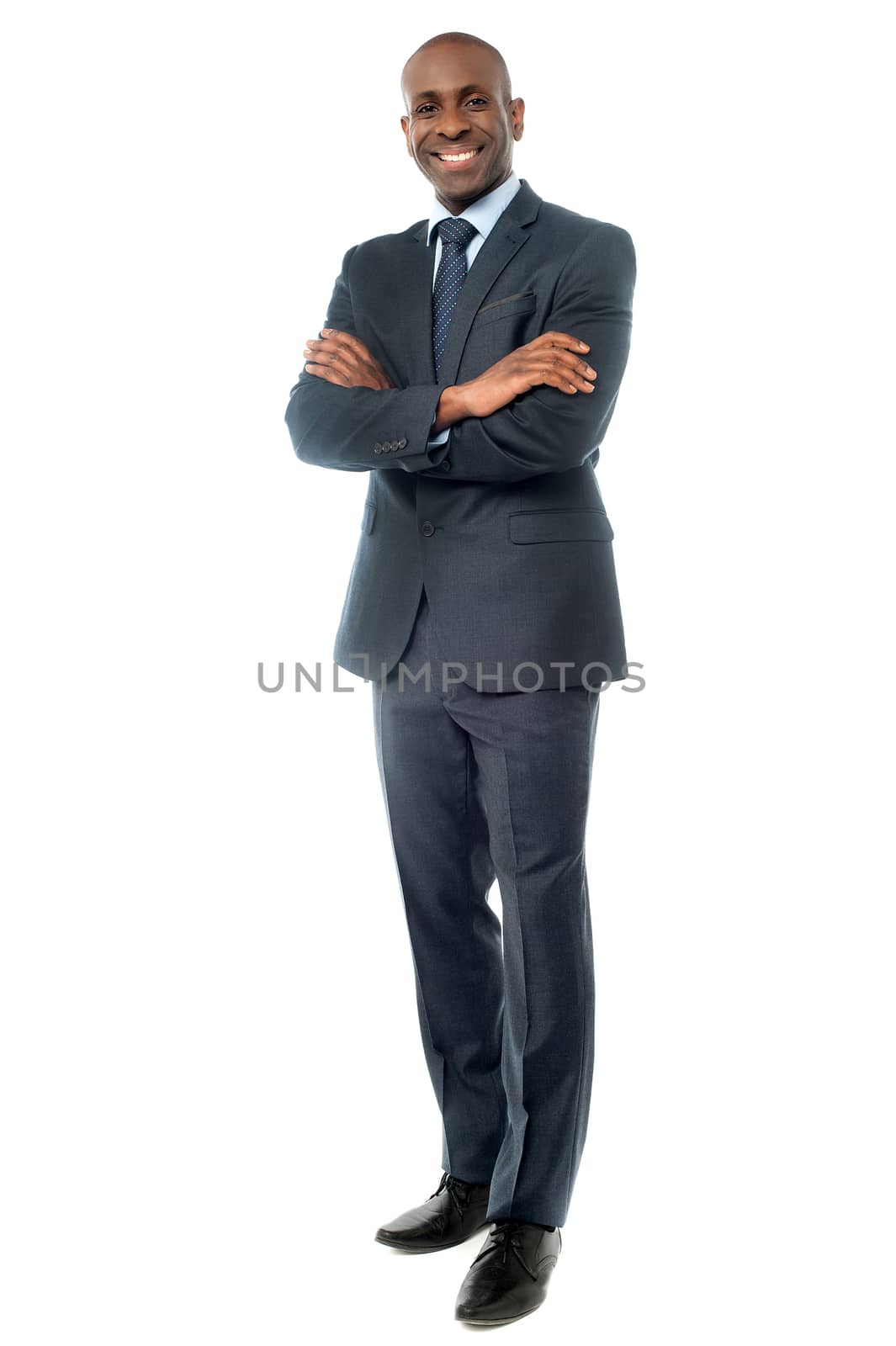 Image of a successful businessman with folded arms