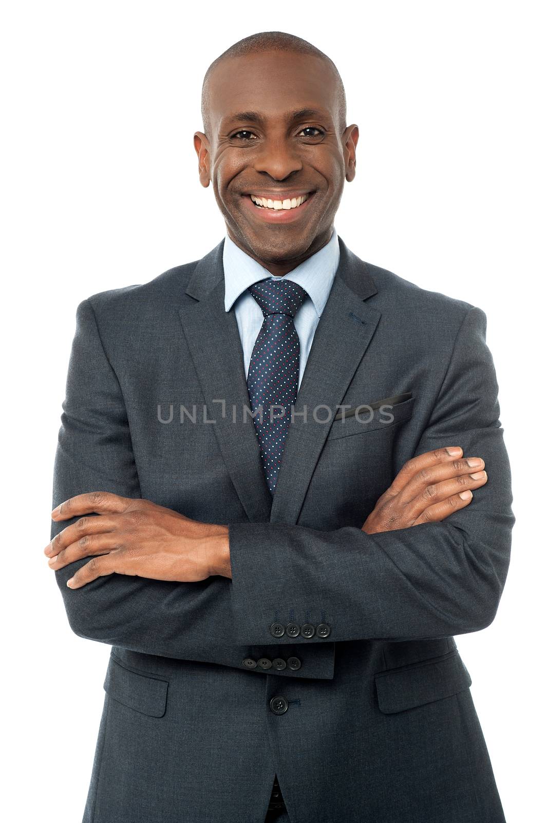 Handsome businessman with arms crossed over white