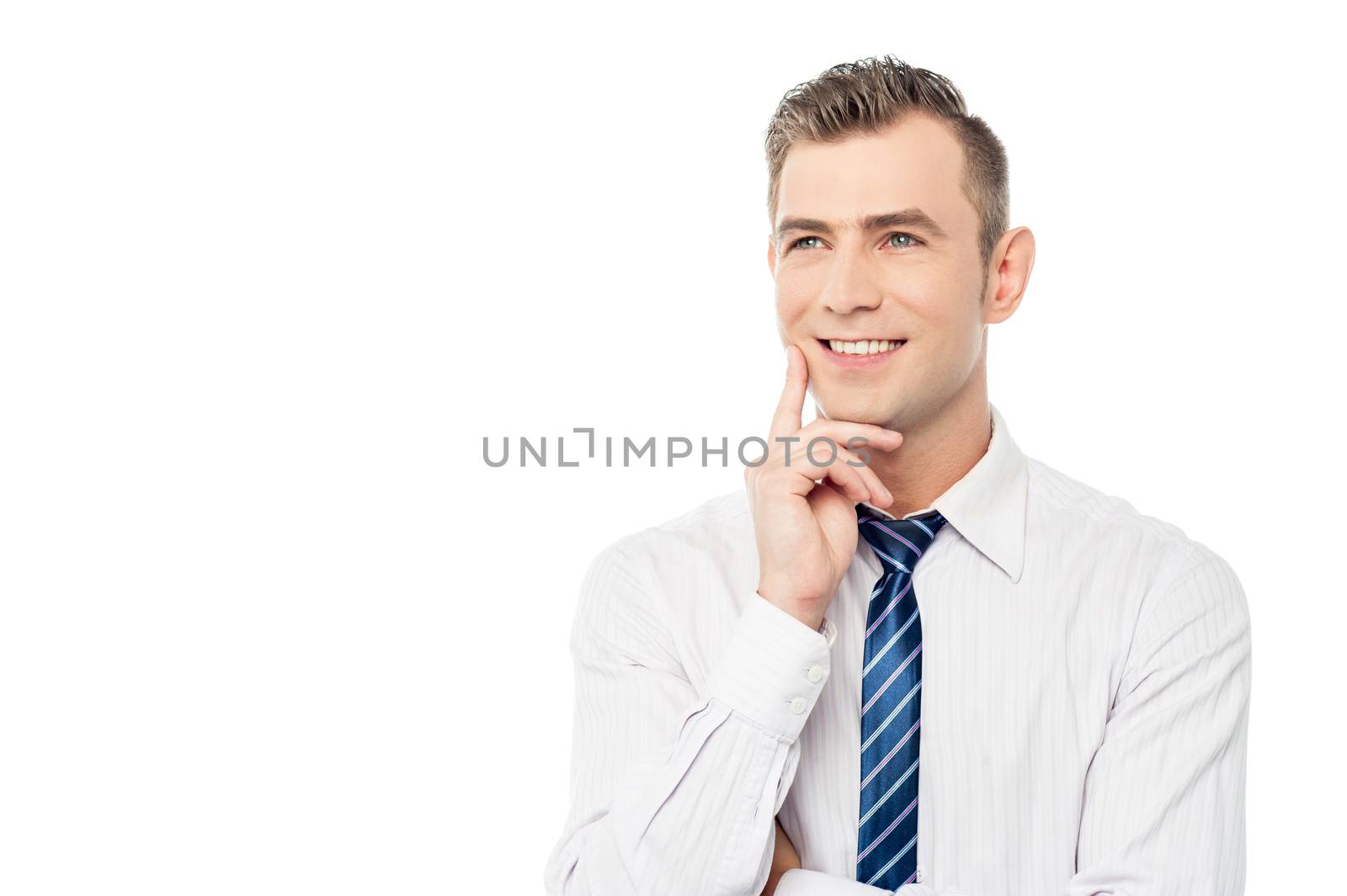 Thoughtful businessman with hand on chin over white