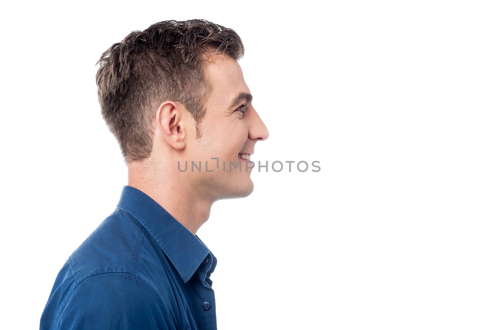 Side pose of young man over white