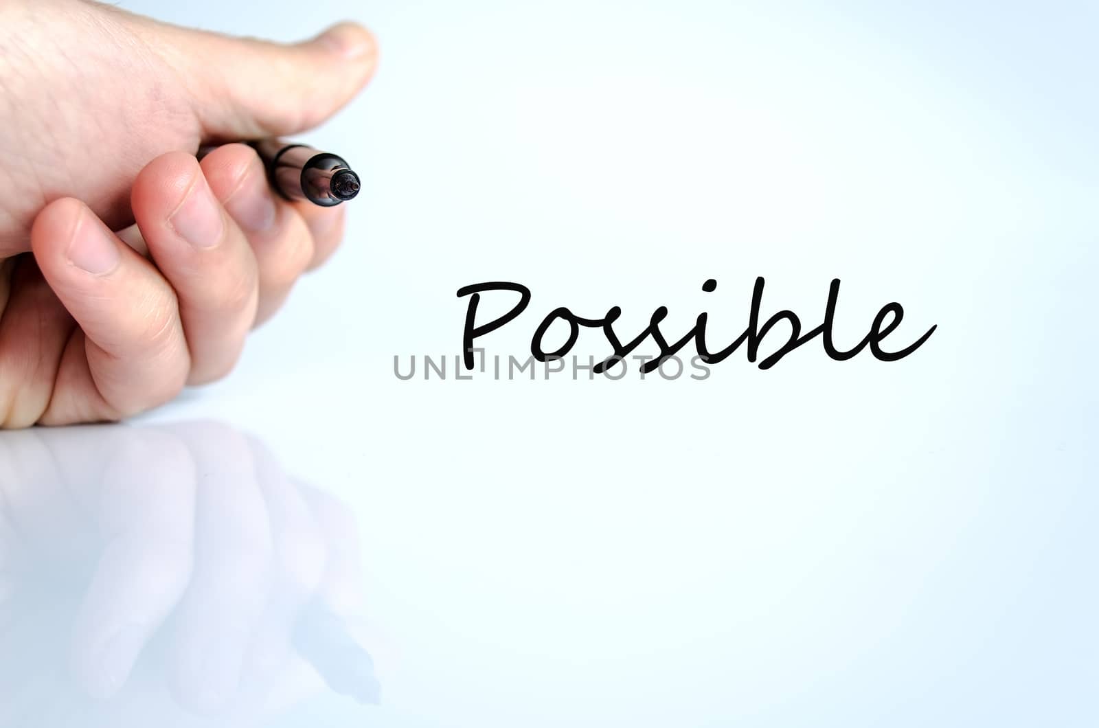 Pen in the hand isolated over white background Possible
