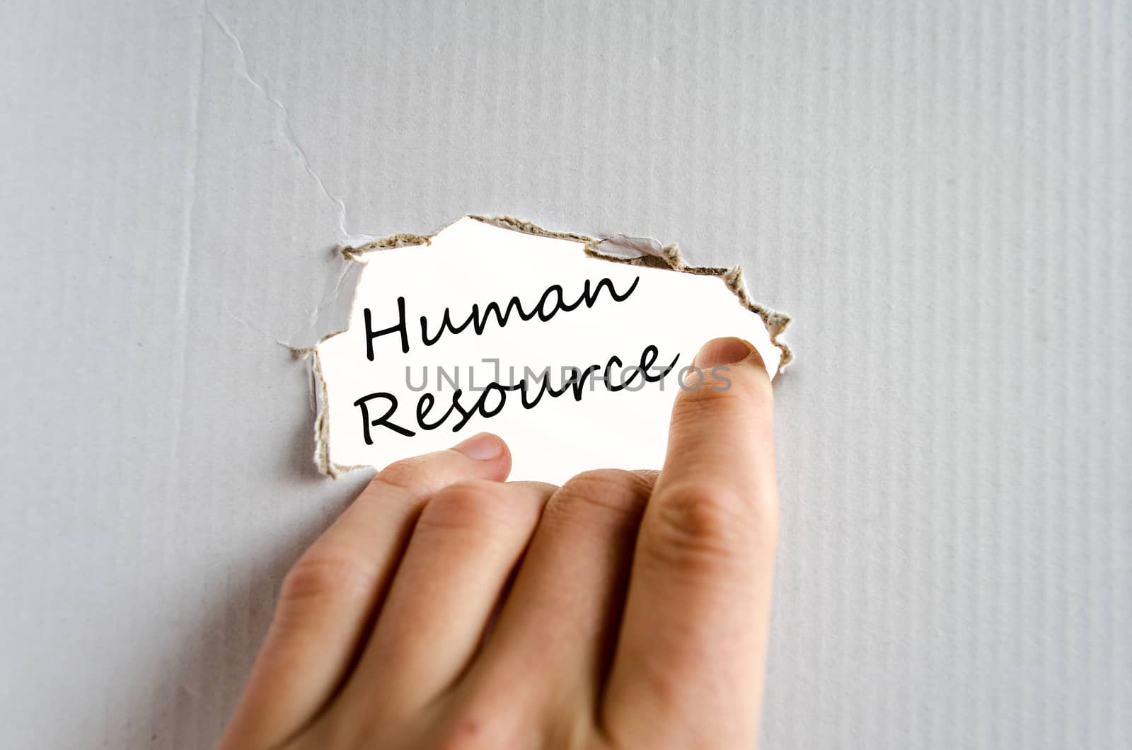 Hand and text on the cardboard background Human resource