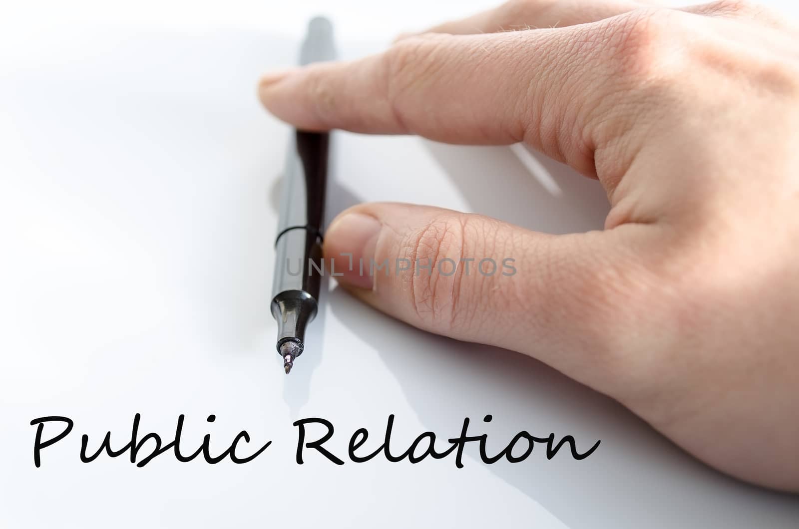 Pen in the hand isolated over white background public relation