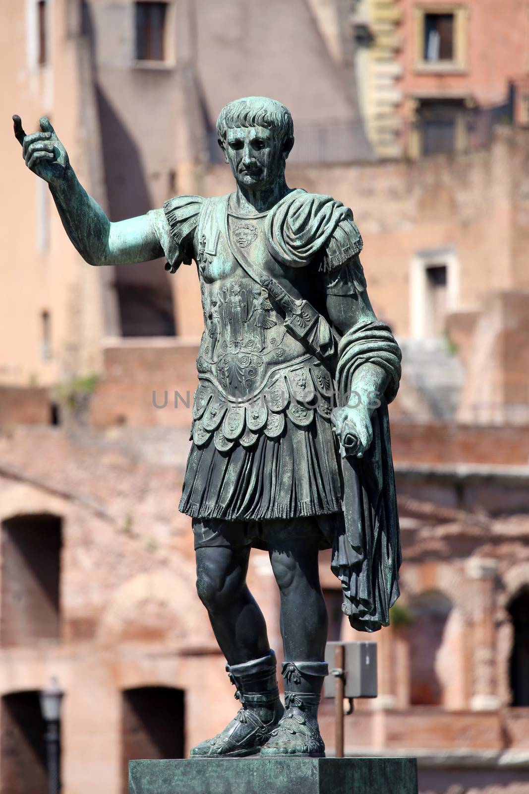 Statue  S.P.Q.R. IMP.CAESARI.NERVAE.F.TRAIANO OPTIMO PRINCIPI1  on street Via dei Fori Imperiali, Rome, Italy