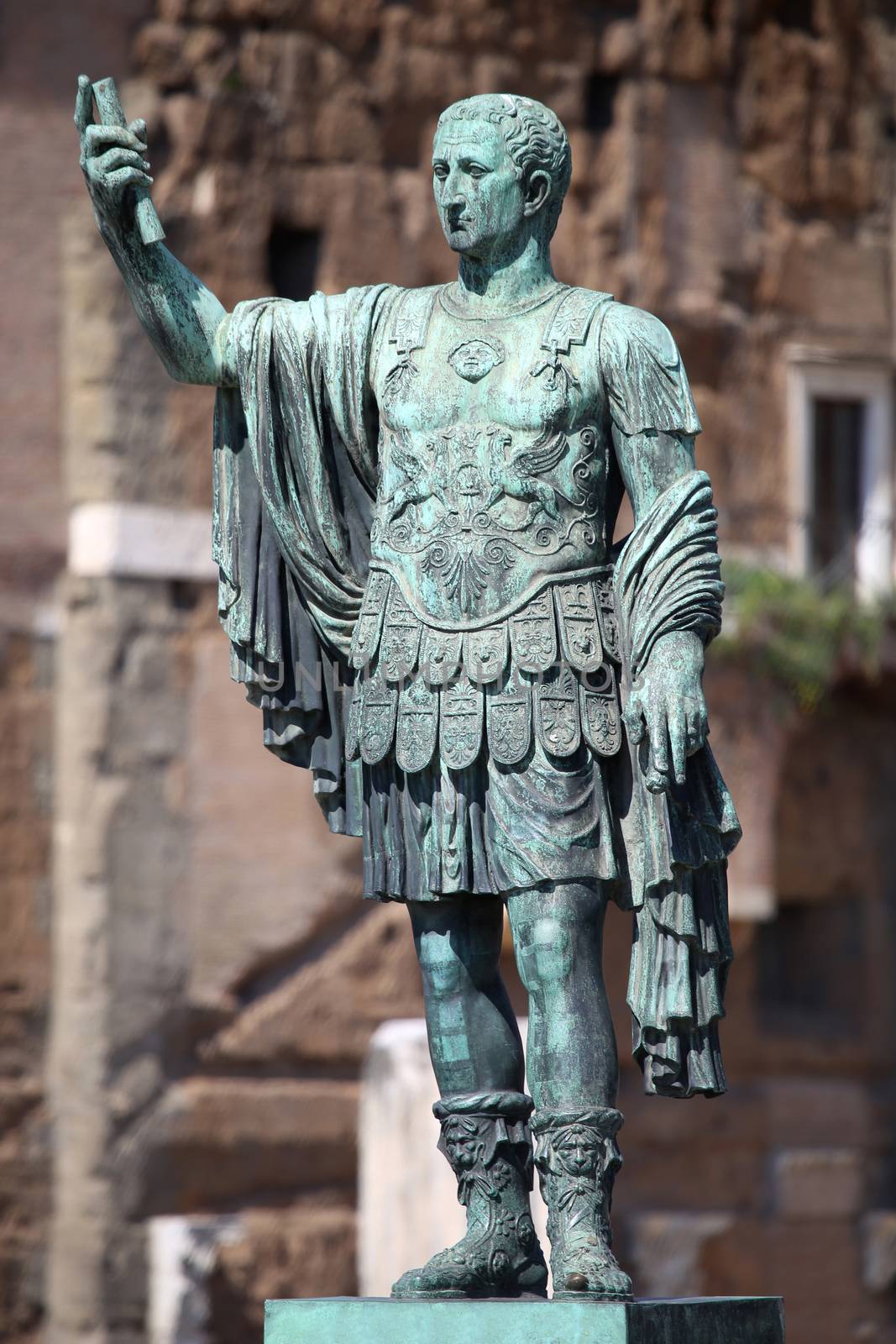 Statue S.P.Q.R. IMP.CAESARI NERVAE Augustus on street Via dei Fori Imperiali, Rome, Italy