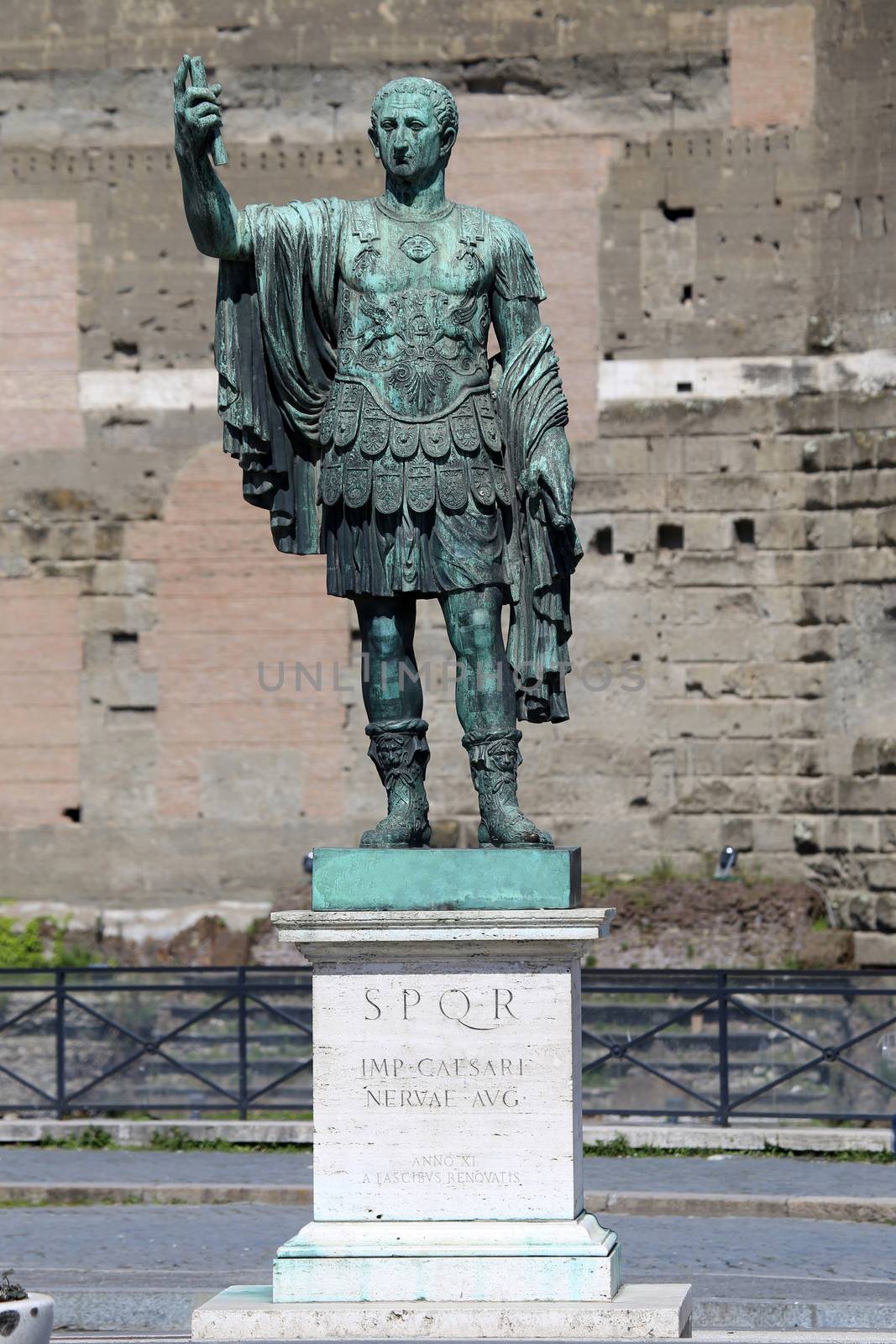 Statue S.P.Q.R. IMP.CAESARI NERVAE Augustus on street Via dei Fori Imperiali, Rome, Italy