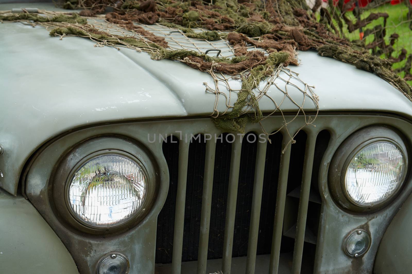  U.S. Army Jeep Front Detail  with combat green camouflage net                               