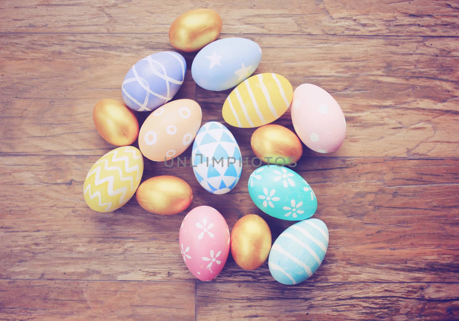 Top view of colorful easter eggs on wooden background with retro by nuchylee