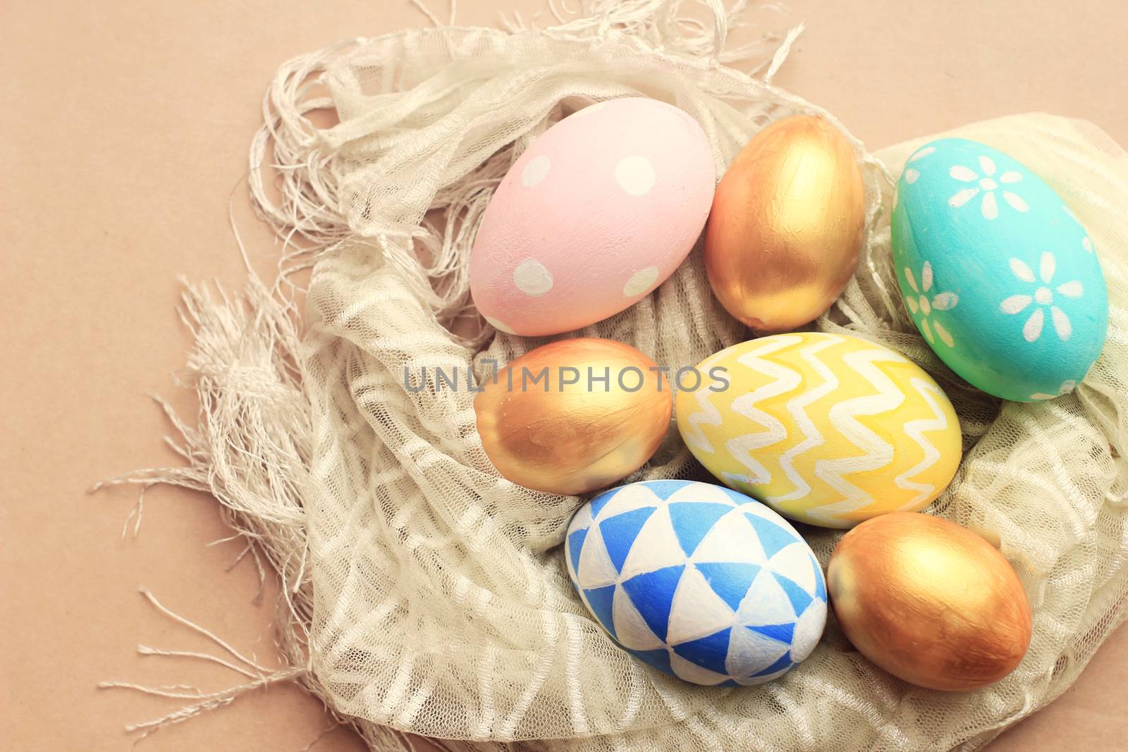 Top view of colorful easter eggs on cloth with retro filter effe by nuchylee