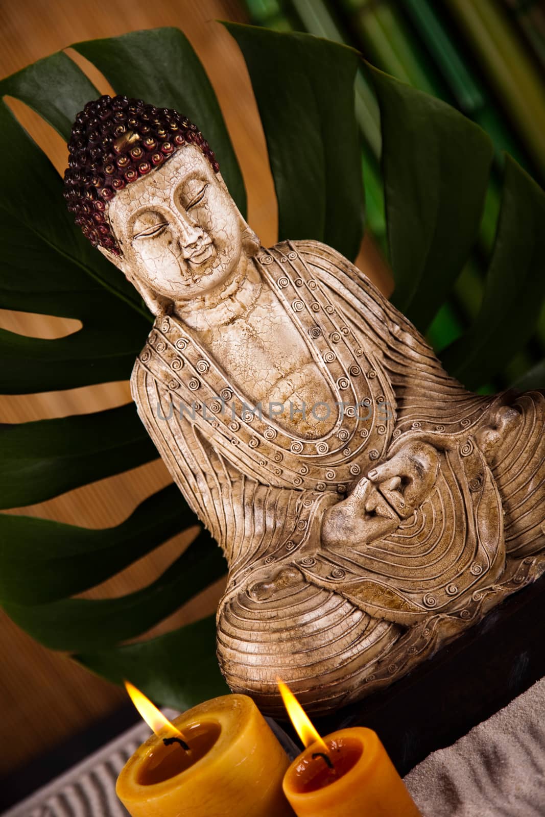 Buddha statue with orchid flower