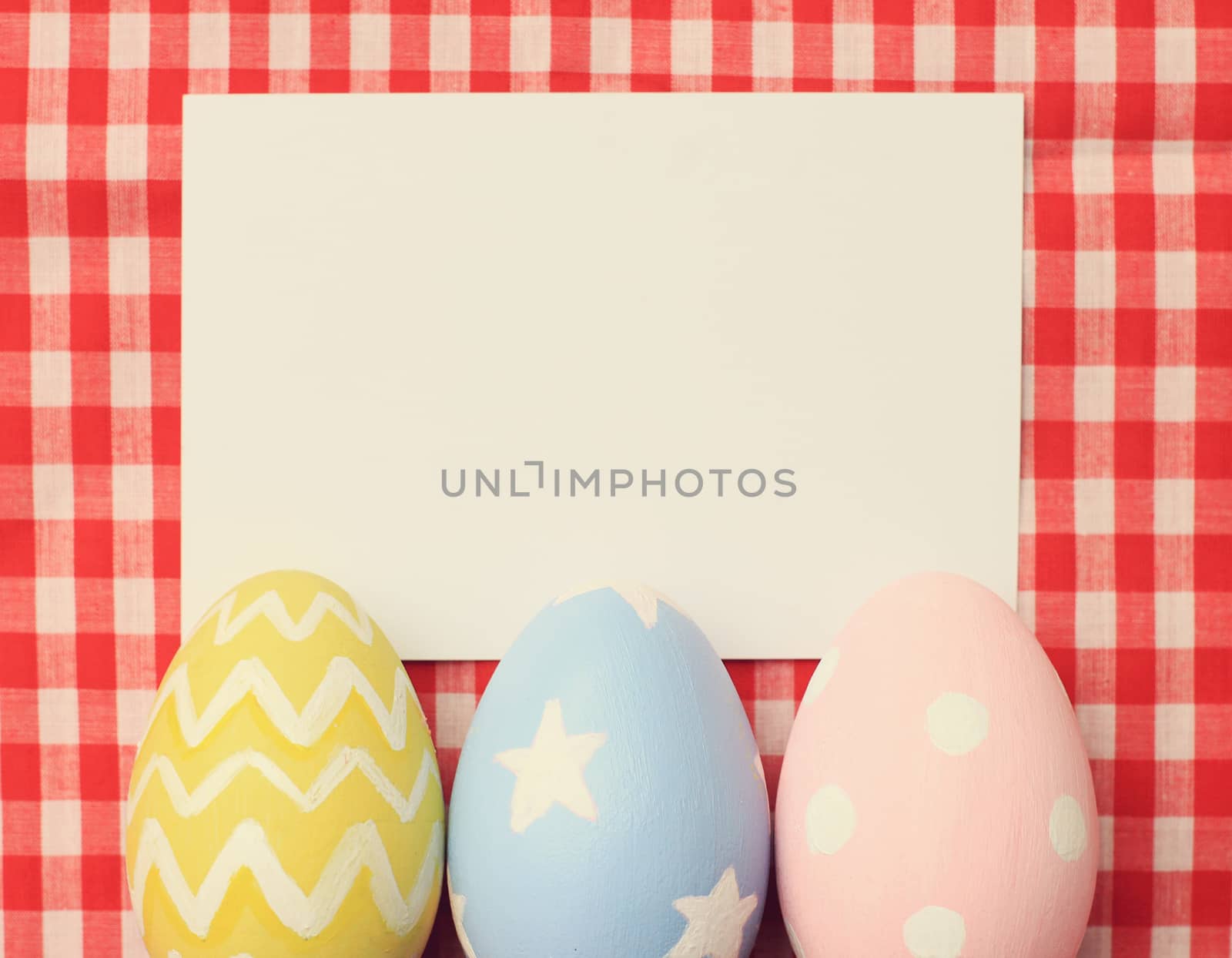 Colorful easter eggs and blank note paper with retro filter effe by nuchylee