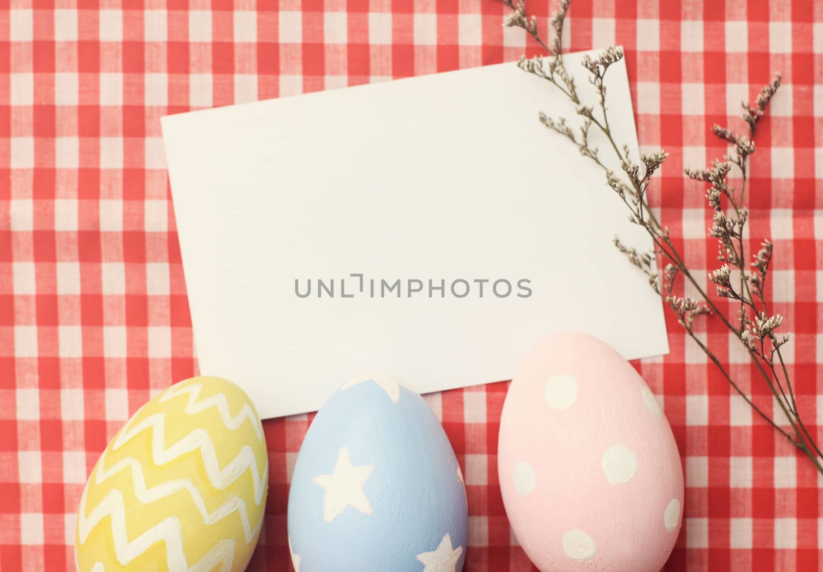 Colorful easter eggs and blank note paper with retro filter effe by nuchylee