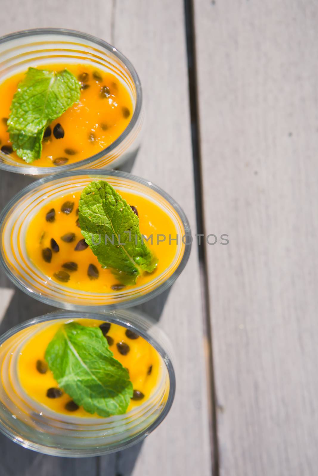 Catering. Salad in a glass on a wooden table