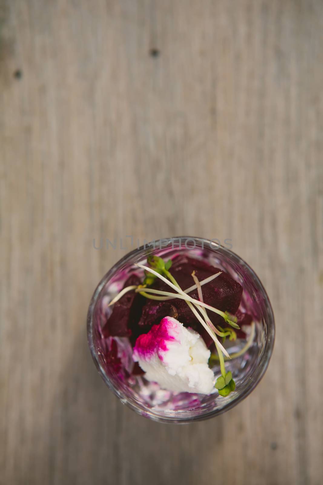 Vegetarian aperitif with beet, goat cheese and soy sprouts