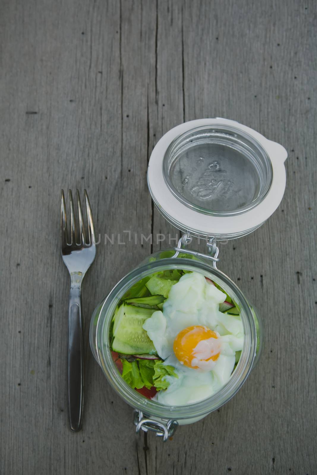 Caesar salad with eggs, cherry tomatoes and grilled chicken