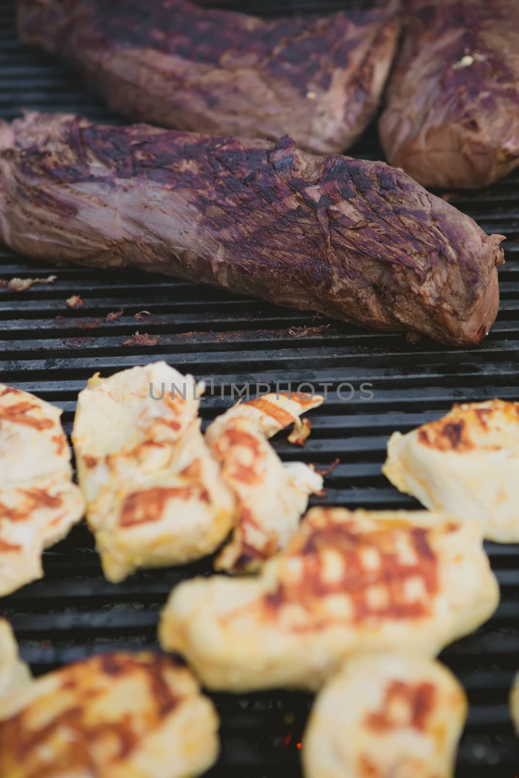 Meat on BBQ. Shallow DOF. by sarymsakov