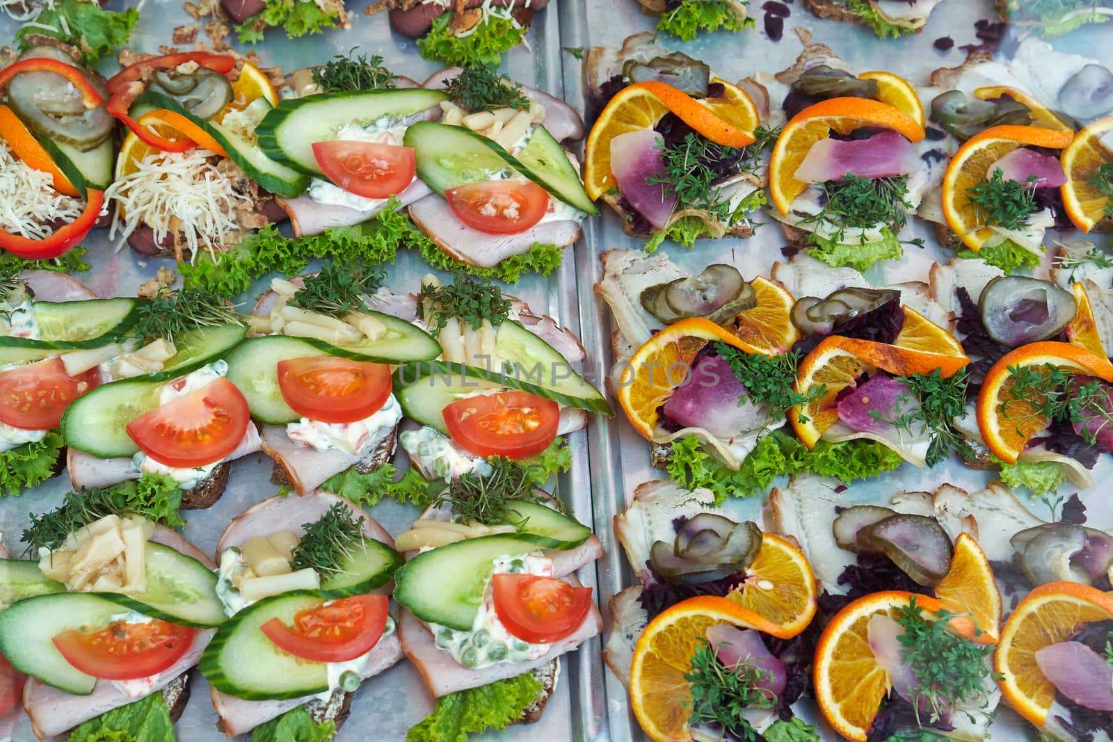 Selection of Smoerrebroed Danish open faced sandwiches on display                            