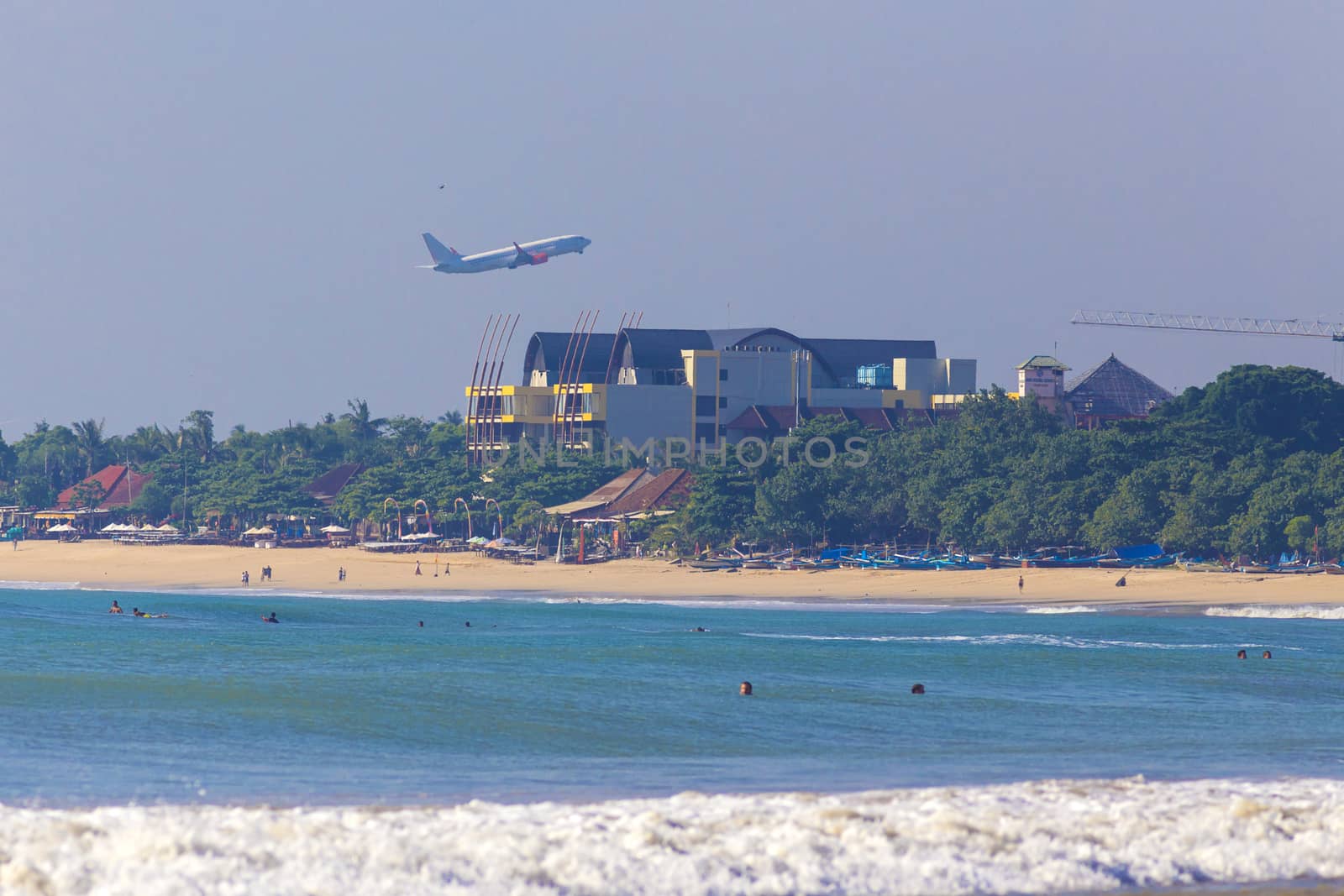 Tropical Jimbaran beach with white sand in Bali, Indonesia