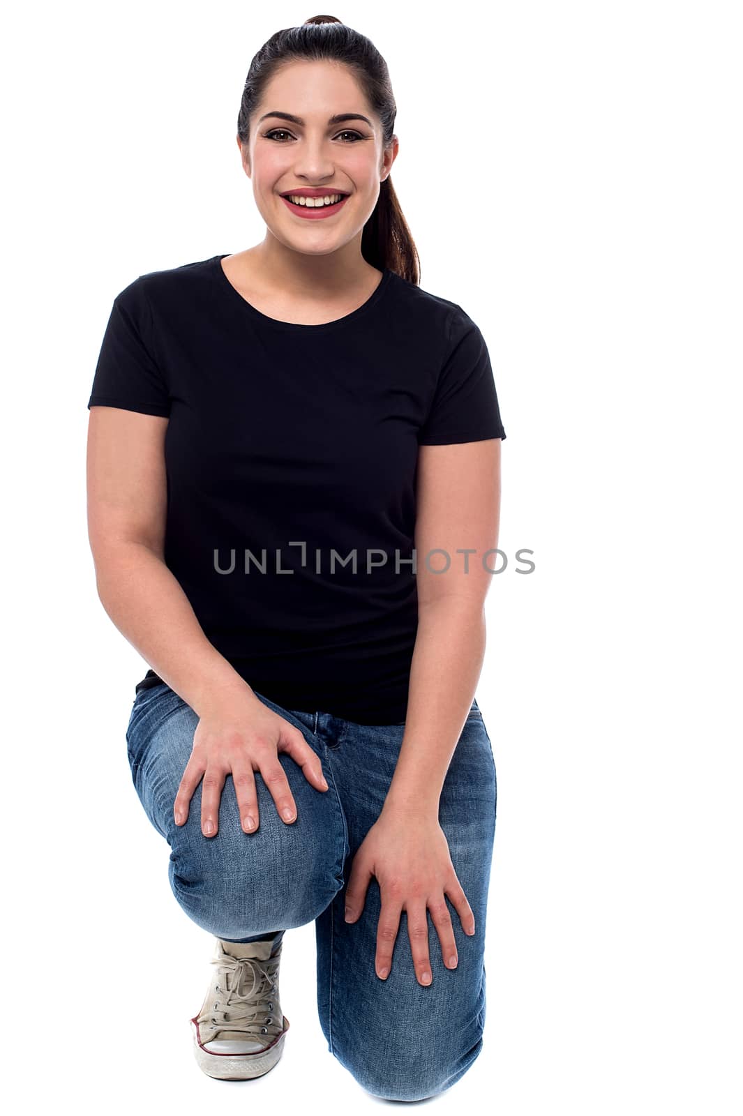 Casual smiling woman posing  by stockyimages