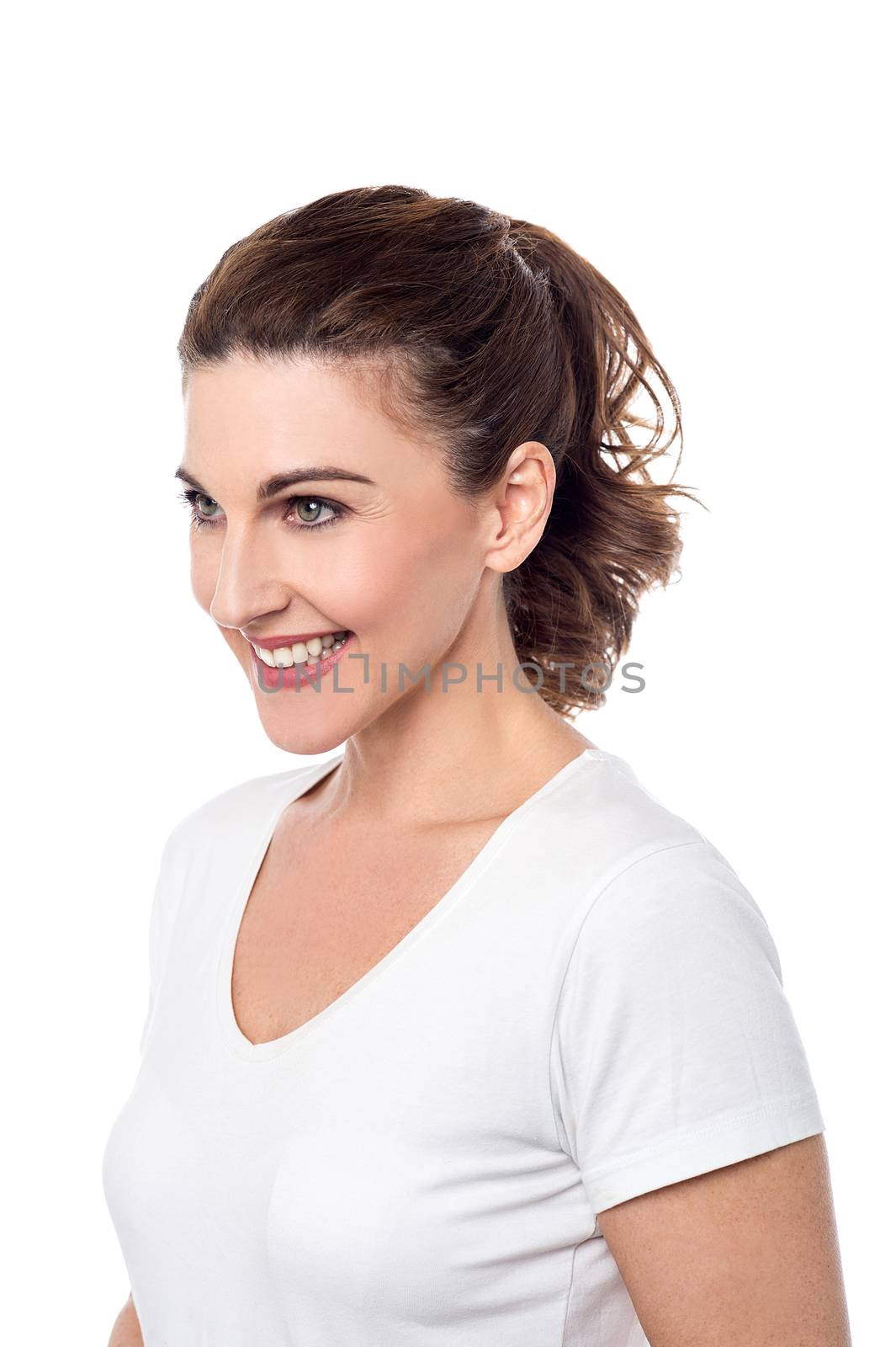 Smiling woman posing sideways.  by stockyimages