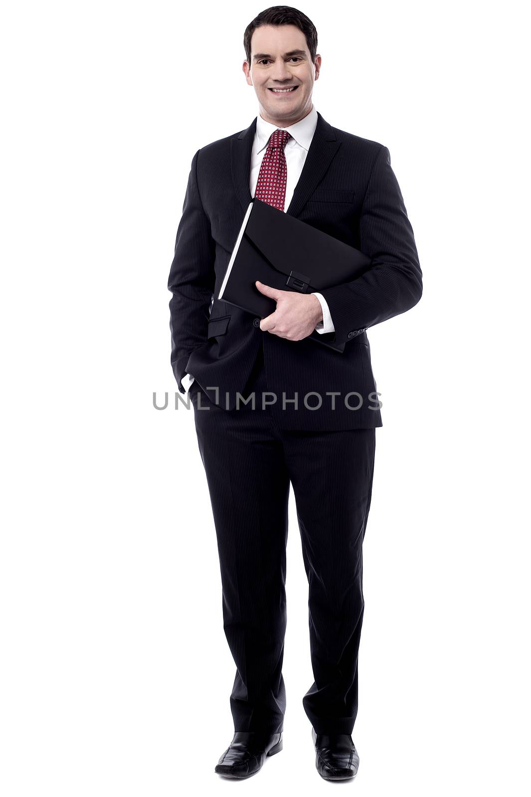 Full length of businessman holding file folder