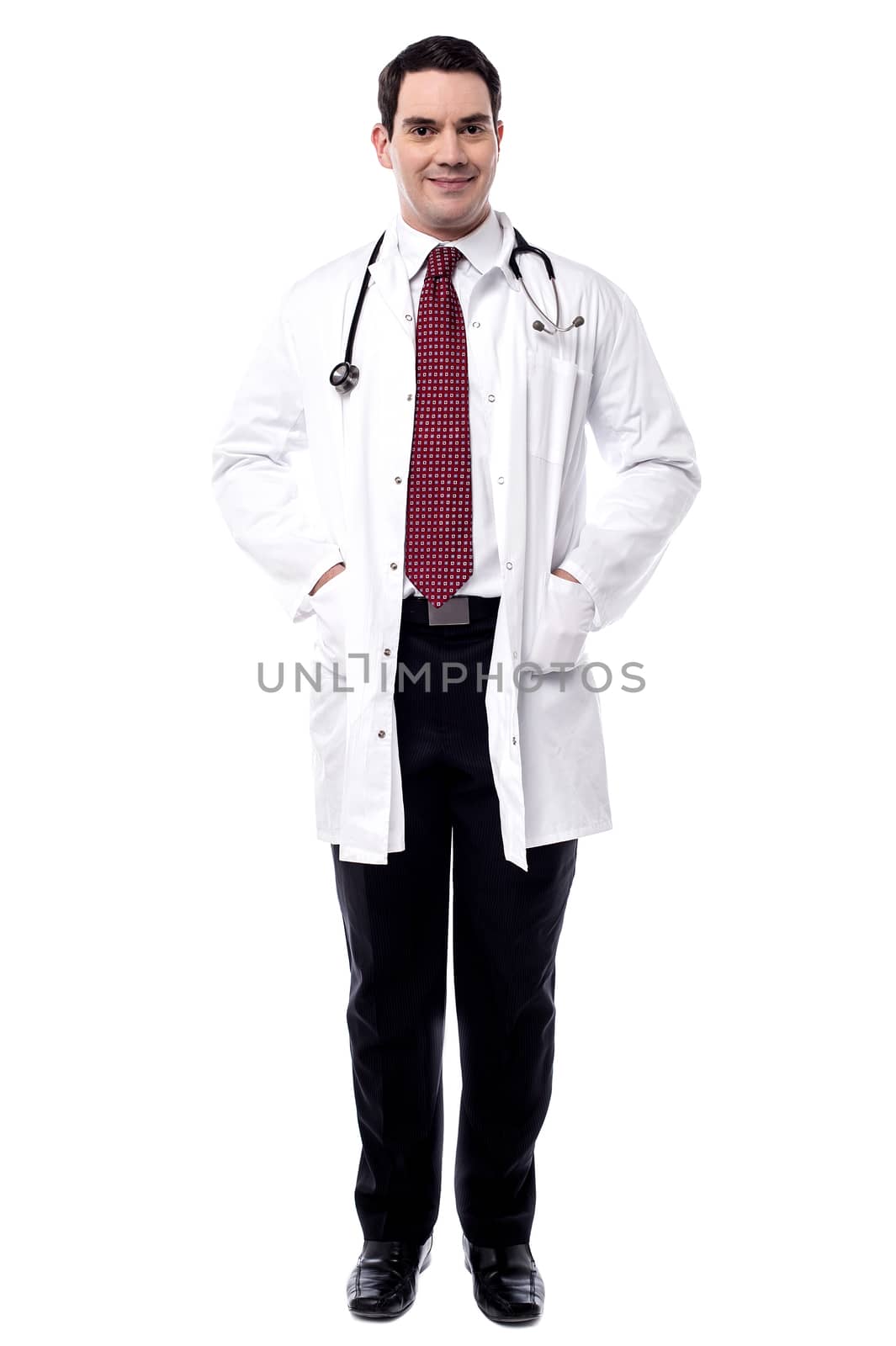 Handsome male doctor with stethoscope by stockyimages