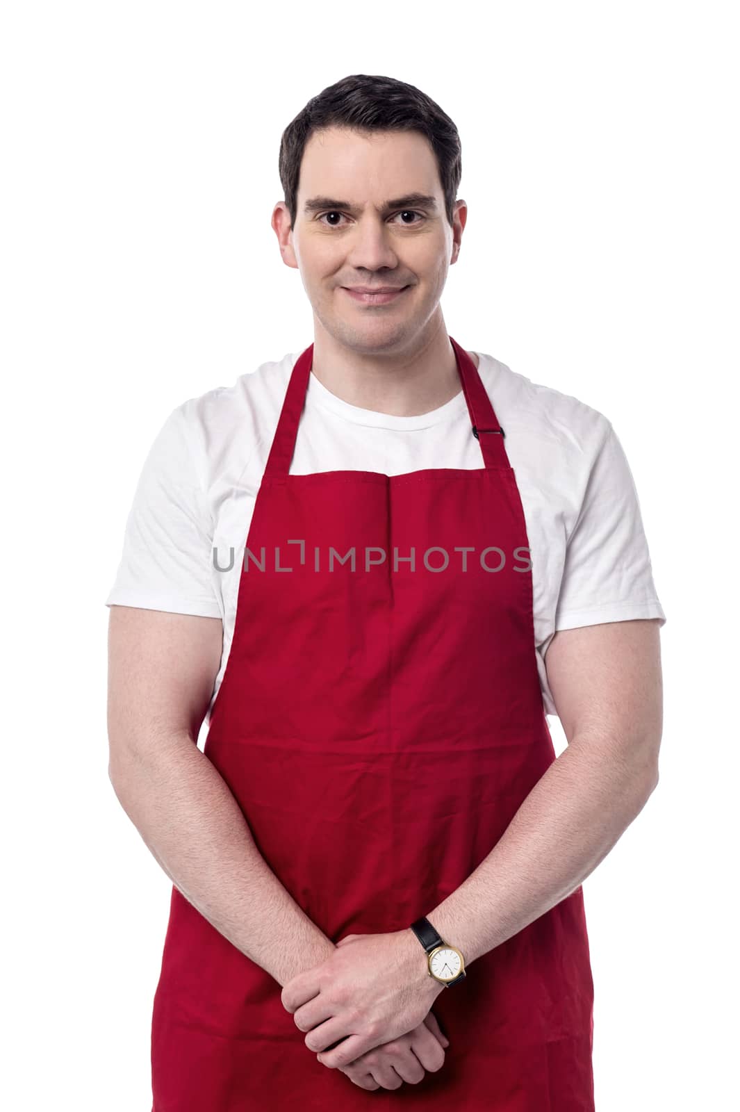 Hands clasped male chef posing to camera