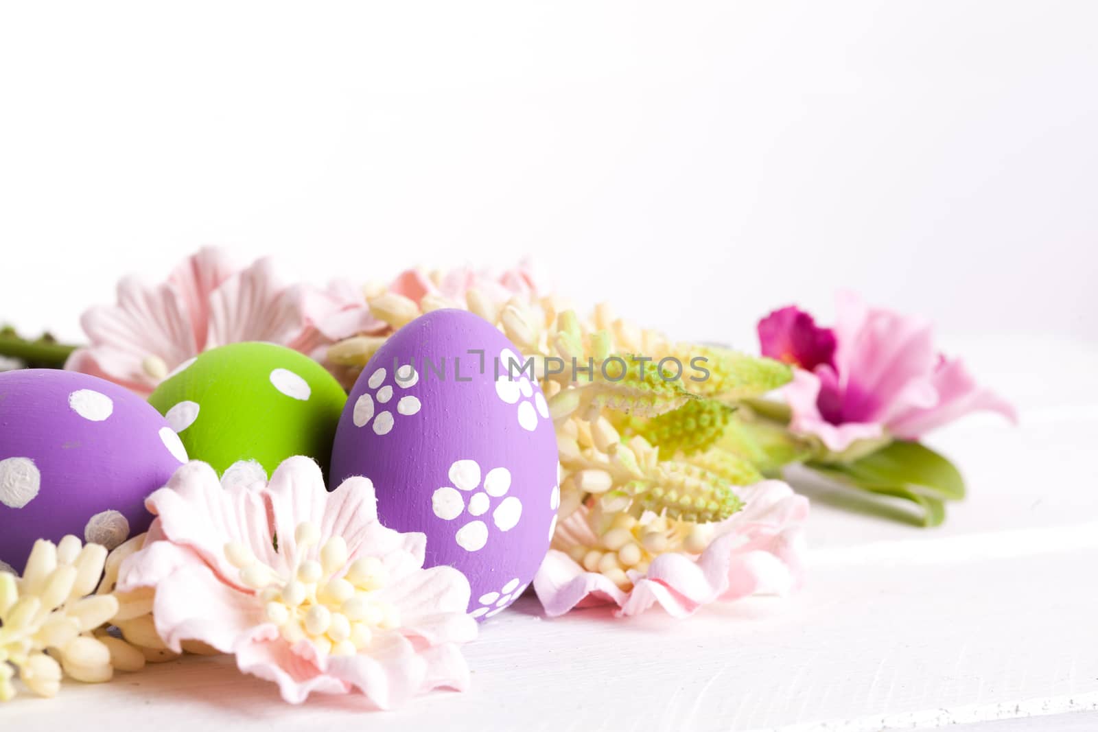 Easter Eggs with Spring Flowers. studio shot