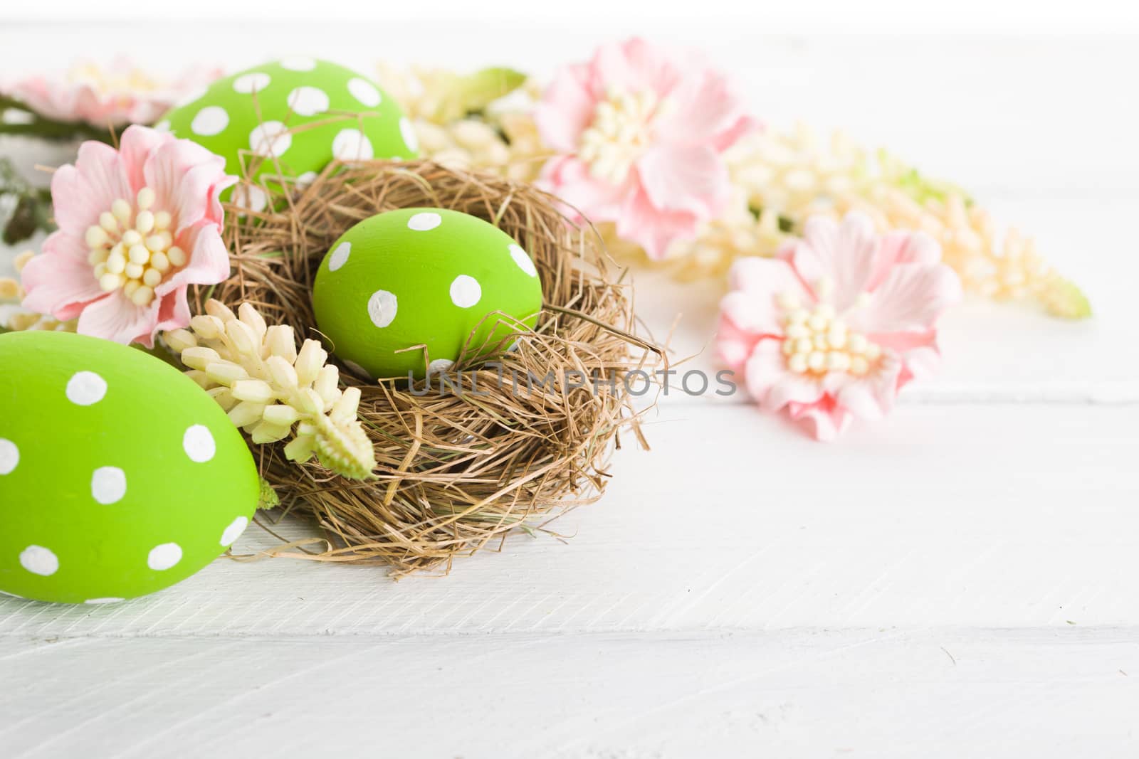 Easter nest with decorative eggs. Studio shot