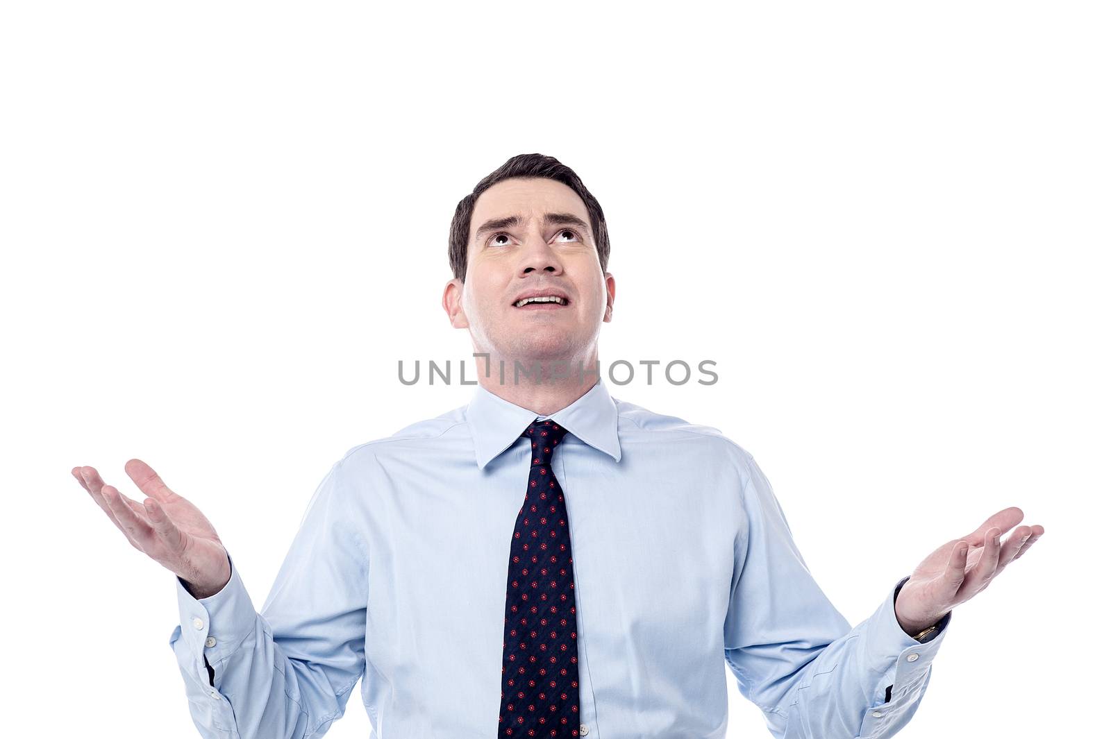 Successful businessman standing with open arms over white