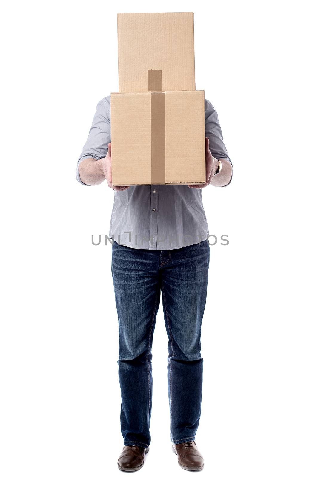 Casual man hiding his face with card boxes