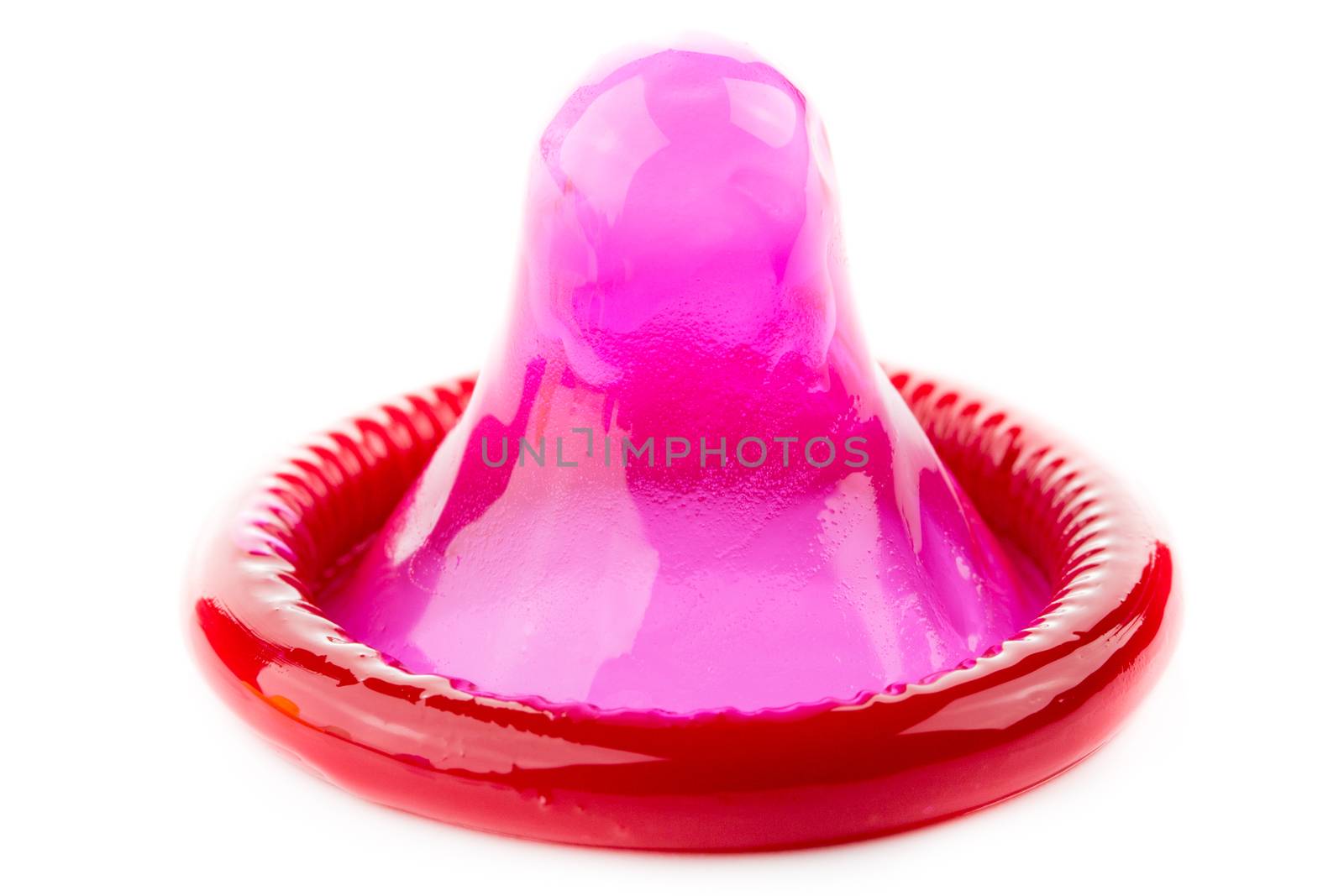 red condom on white background
