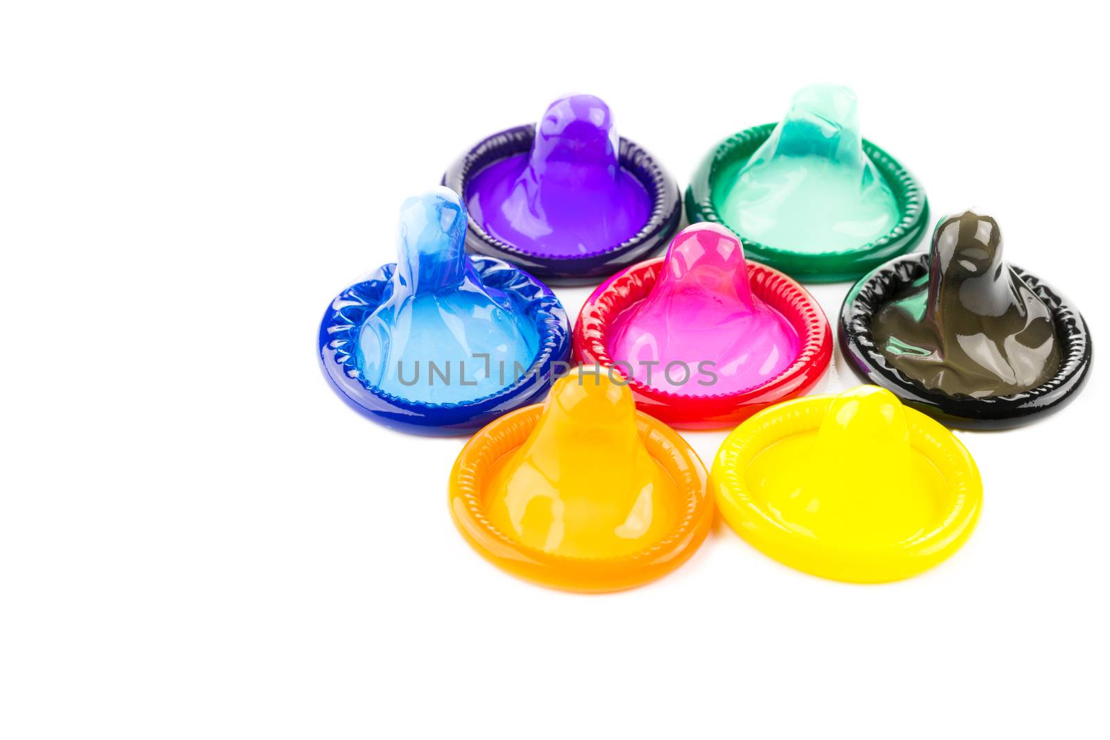 Condom in many colour on white background