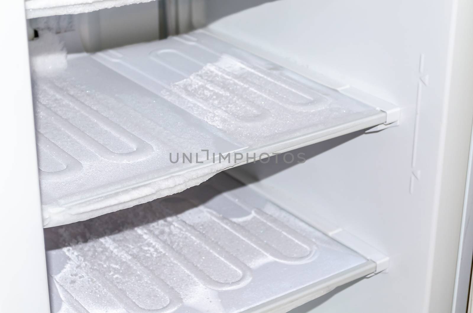 View of an empty freezer. The freezer is defrosted