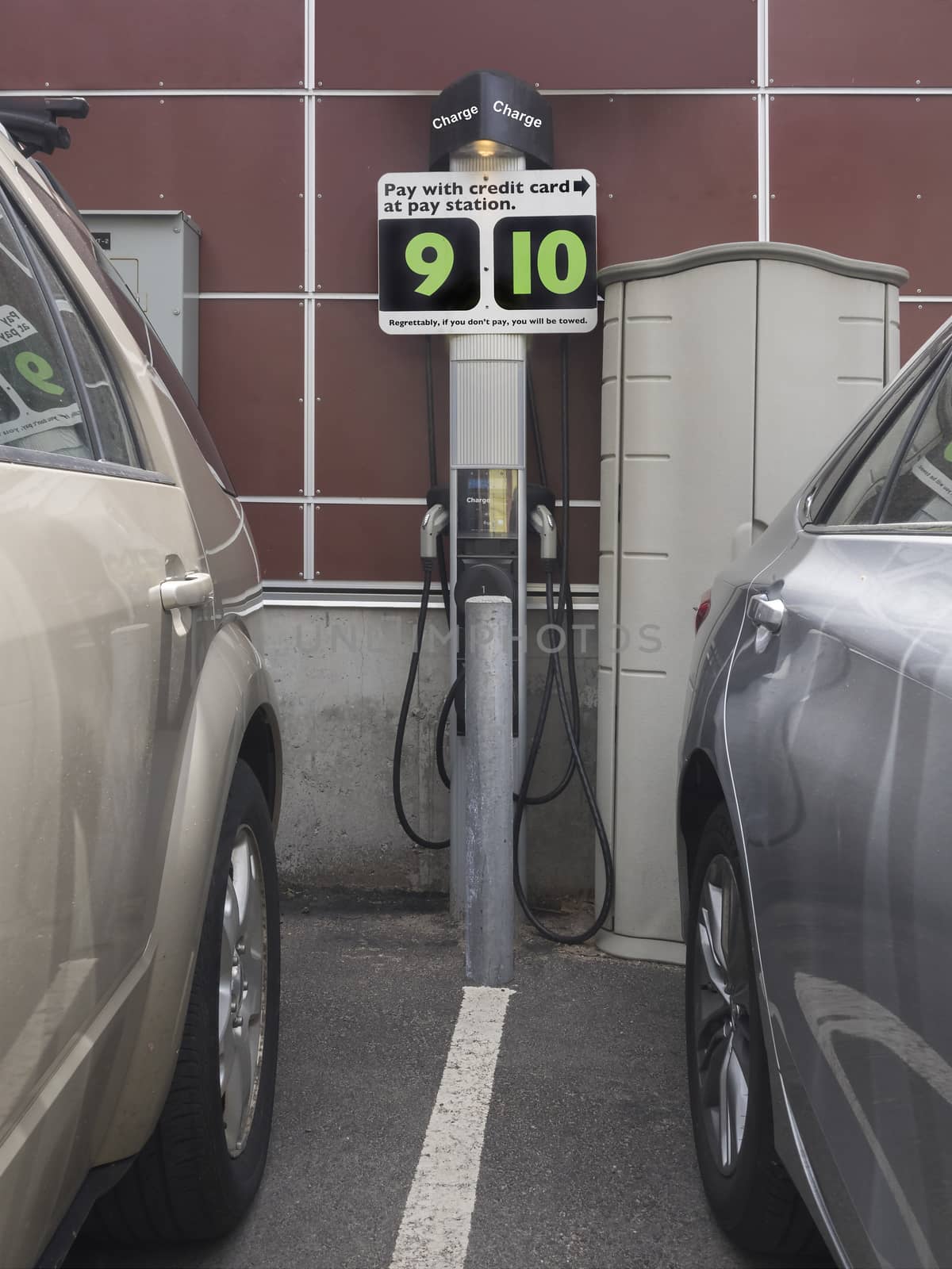 Electric car charging station with credit card or cast payment options