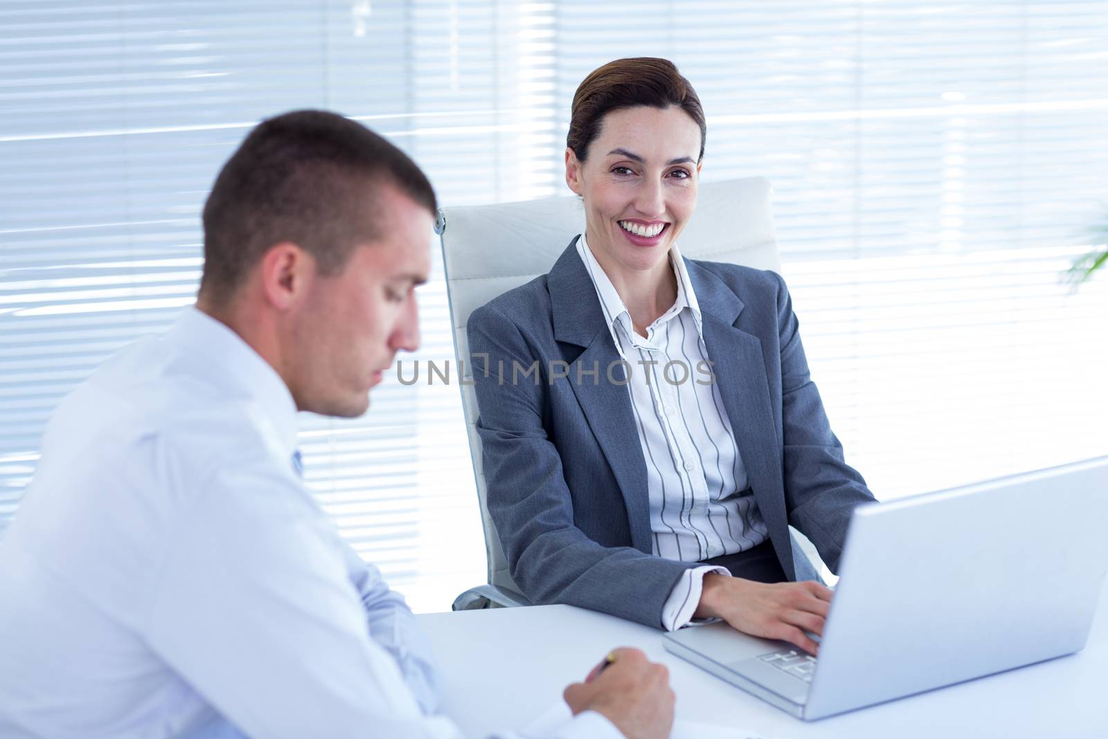 Business people in discussion in an office at work