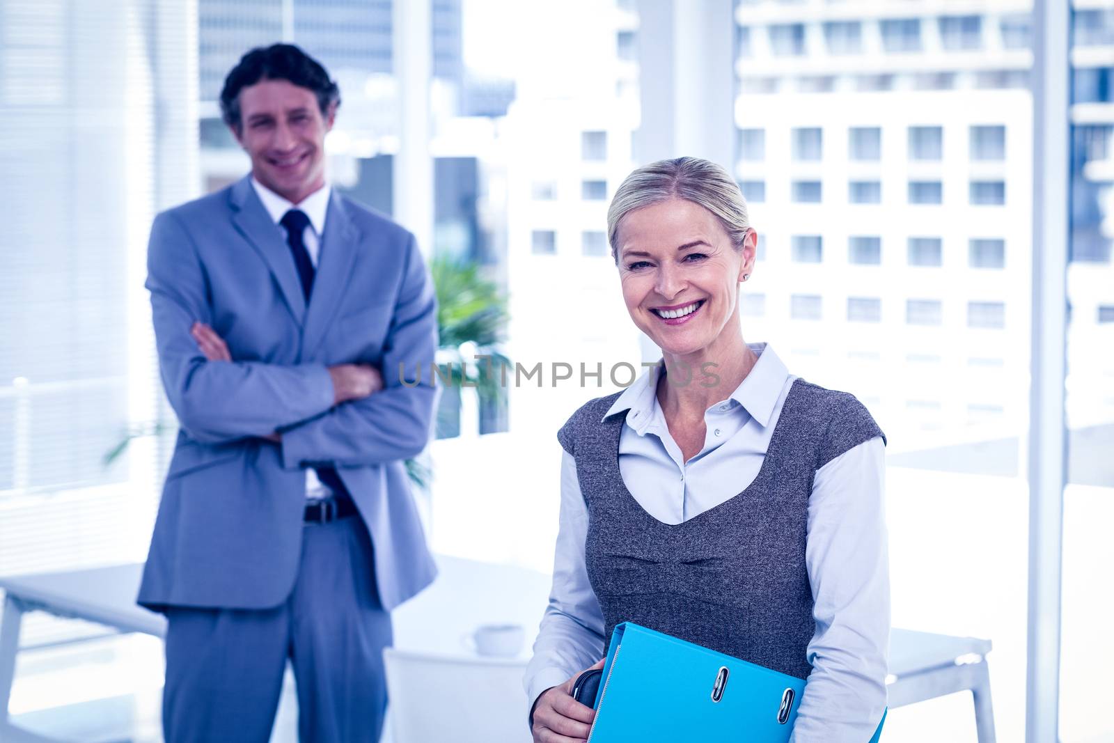 Business people smiling at the camera by Wavebreakmedia