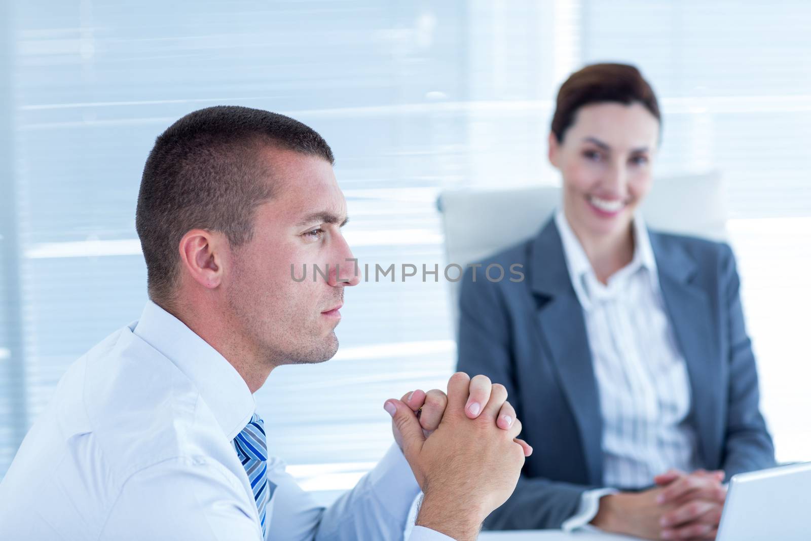 Business people in discussion in an office at work