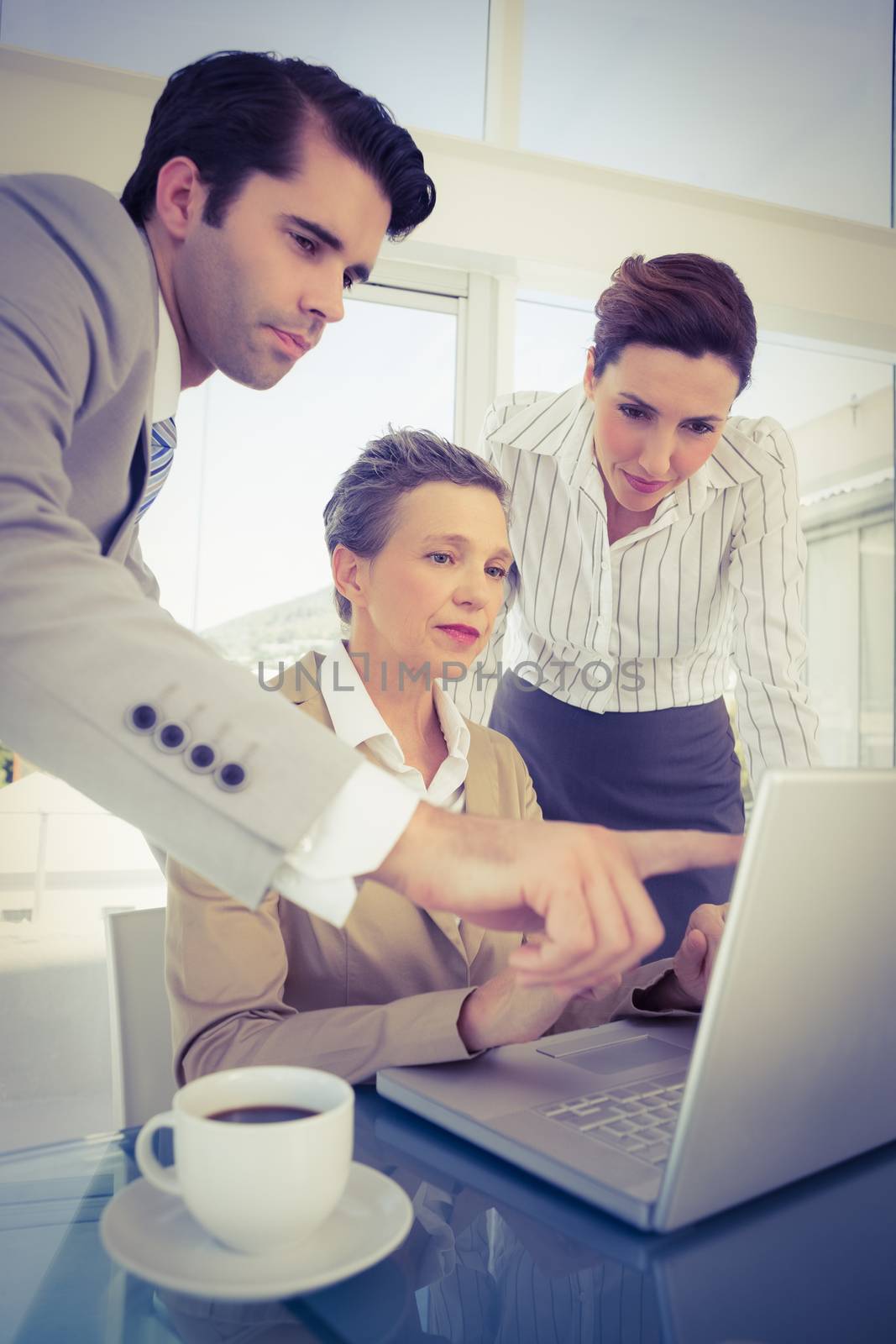 Business partners working on laptop  by Wavebreakmedia