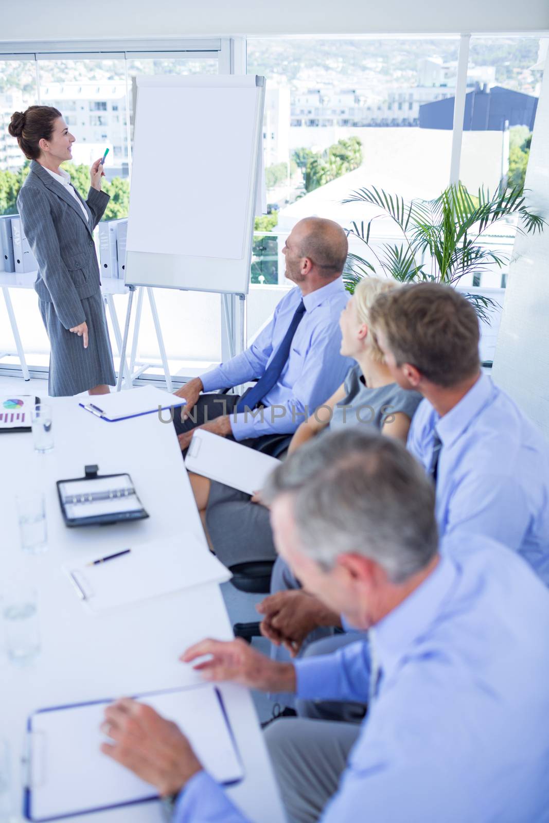 Business people listening during meeting in office 