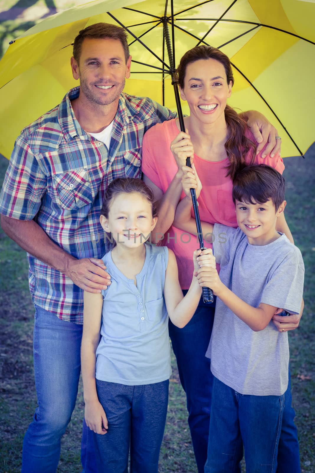 Happy family in the park together on a sunny day