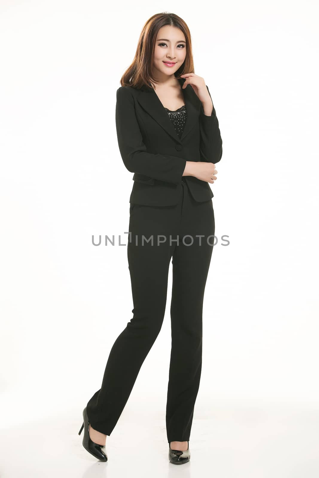 Young Asian women wearing a suit in front of a white background by quweichang