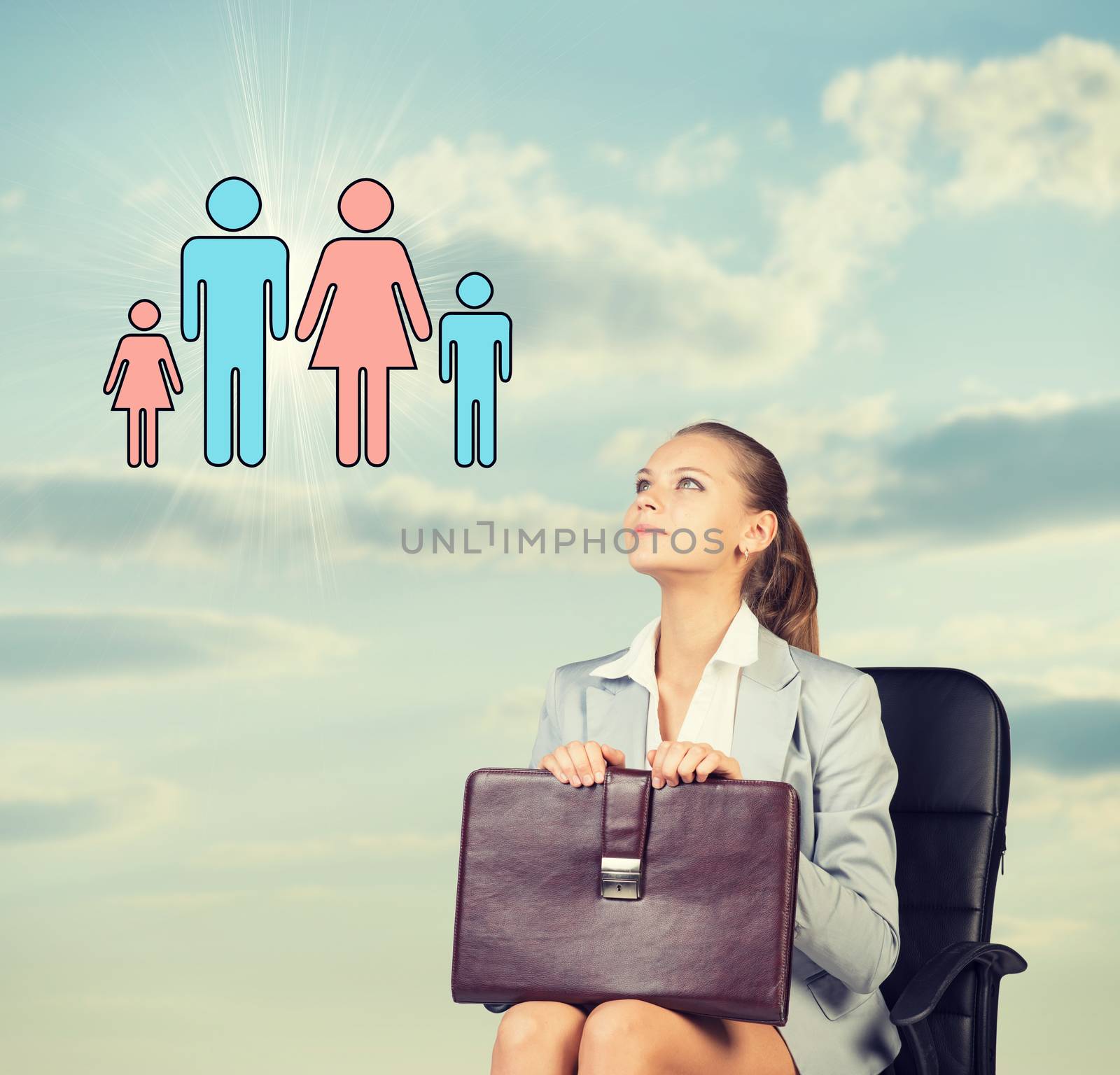 Business woman in skirt, blouse and jacket, sitting on chair imagines family. Against background of sky, clouds by cherezoff